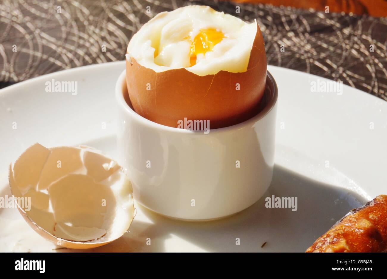 Eating a soft boiled egg for breakfast Stock Photo Alamy