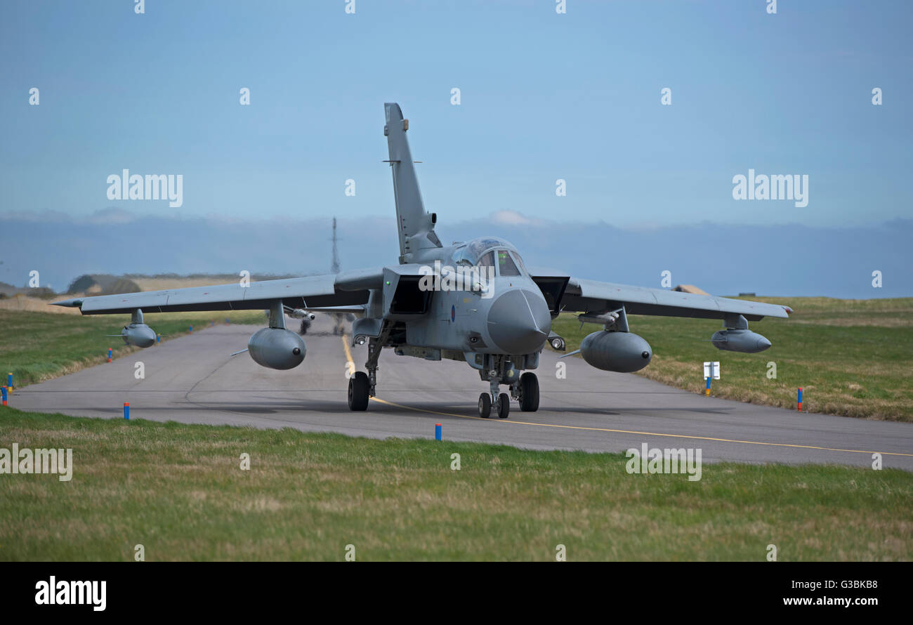 An RAF GR4 Tornado on the perimeter taxiway at the Lossiemouth home base in Scotland.  SCO 10,503. Stock Photo