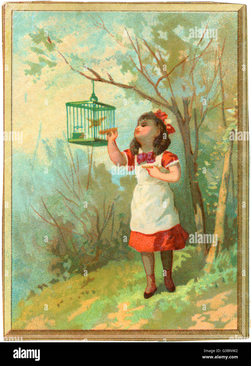GIRL FEEDS CAGED BIRD Stock Photo
