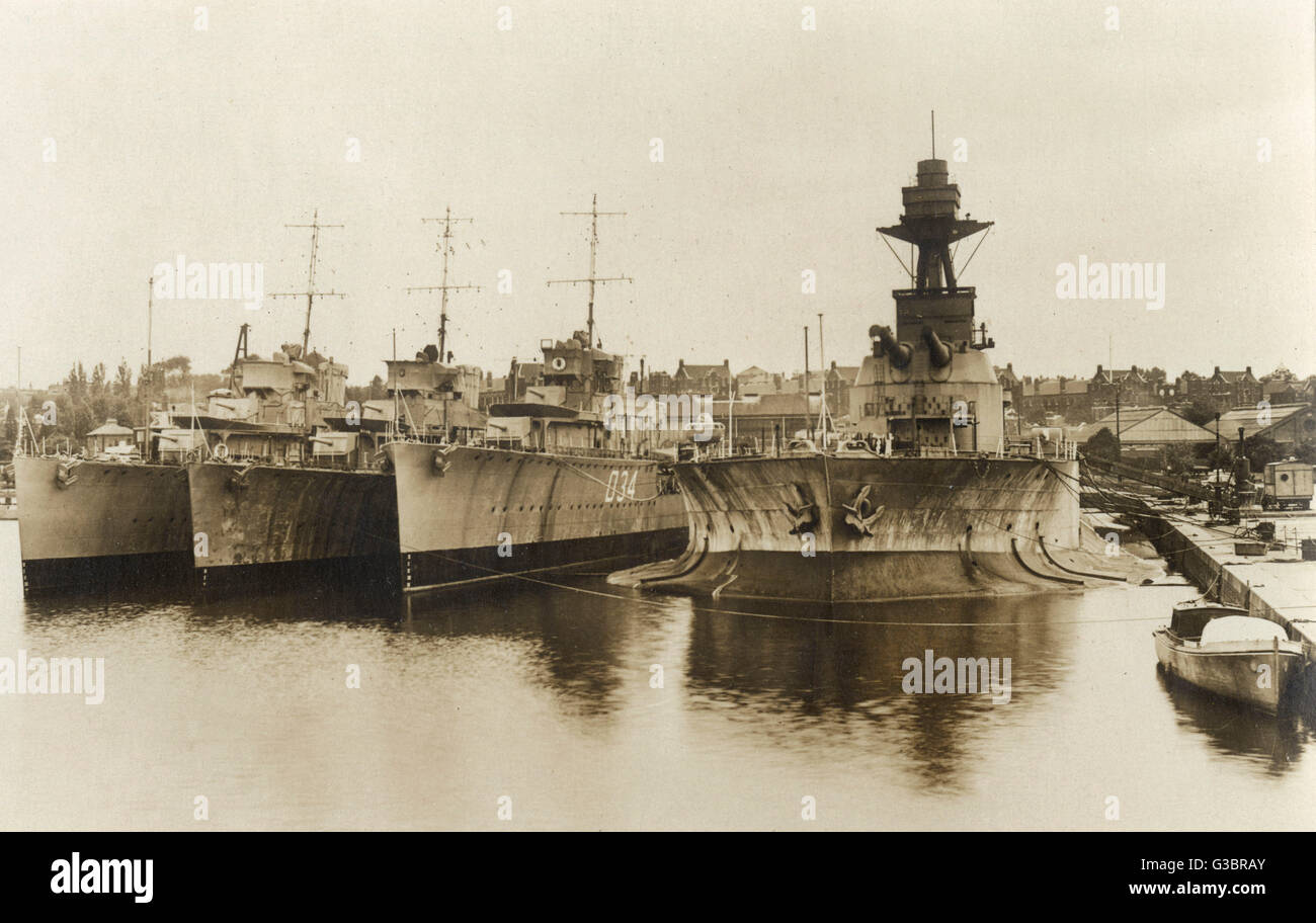 Ships in Chatham Dockyard, Kent.  They are the Monitor HMS Marshal Soult, the D34 Destroyer HMS Velox, and two V Class destroyers.       Date: circa 1930 Stock Photo