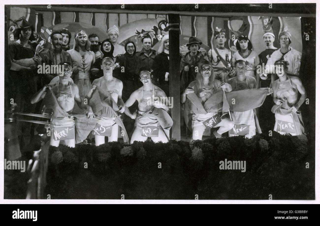 A Christmas Show (Pantomime) performed by British Prisoners of War - during WW2. Possibly one of the less glamorous chorus lines of the 1940s (foreground) !!!     Date: circa 1942 Stock Photo