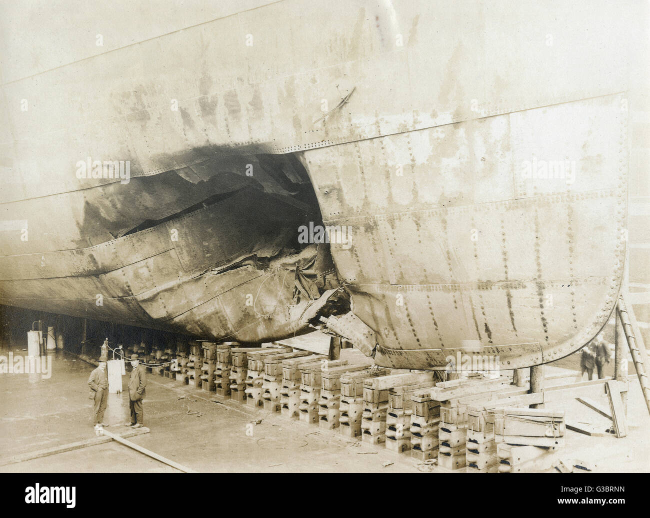 Ship in dry dock with damaged hull Stock Photo
