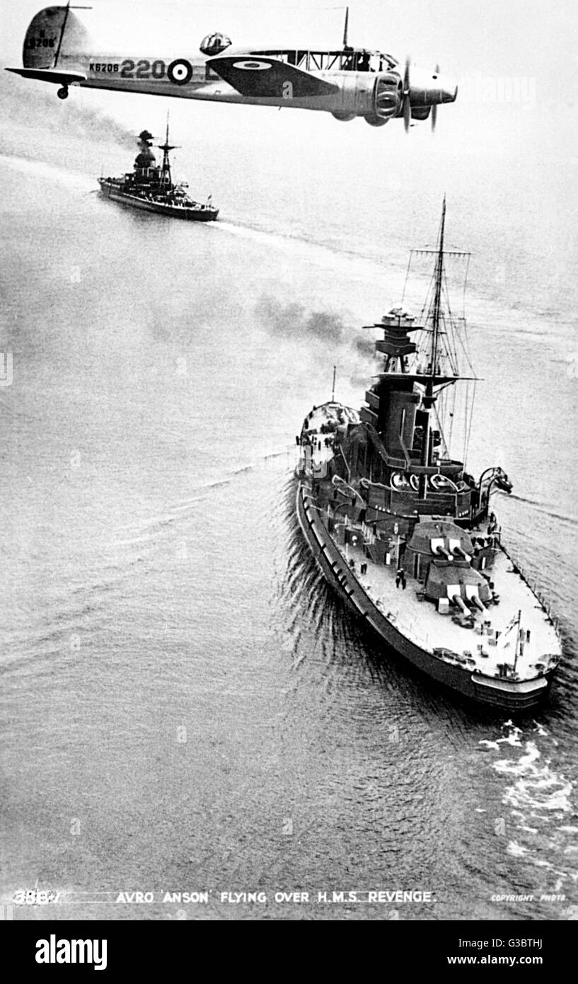 Avro Anson 220, British twin engine aeroplane, seen here flying over the battleship HMS Revenge during the Second World War.      Date: 1940 Stock Photo