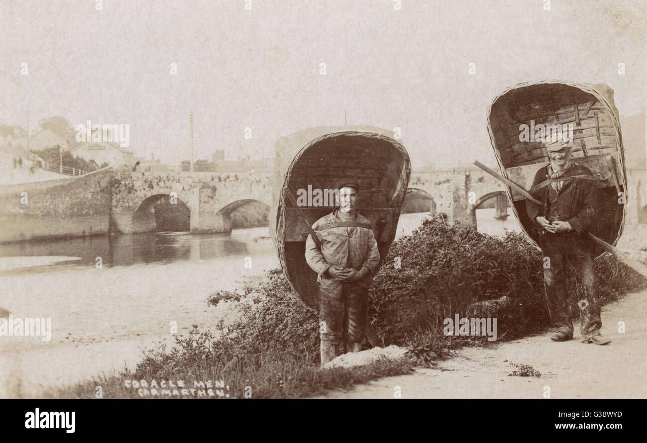 Welsh Coracle men - Carmarthen, Wales. The Carmarthen coracle is of a rounder and deeper design, as it is used in tidal waters on the Tywi River, where there are no rapids.     Date: 1905 Stock Photo