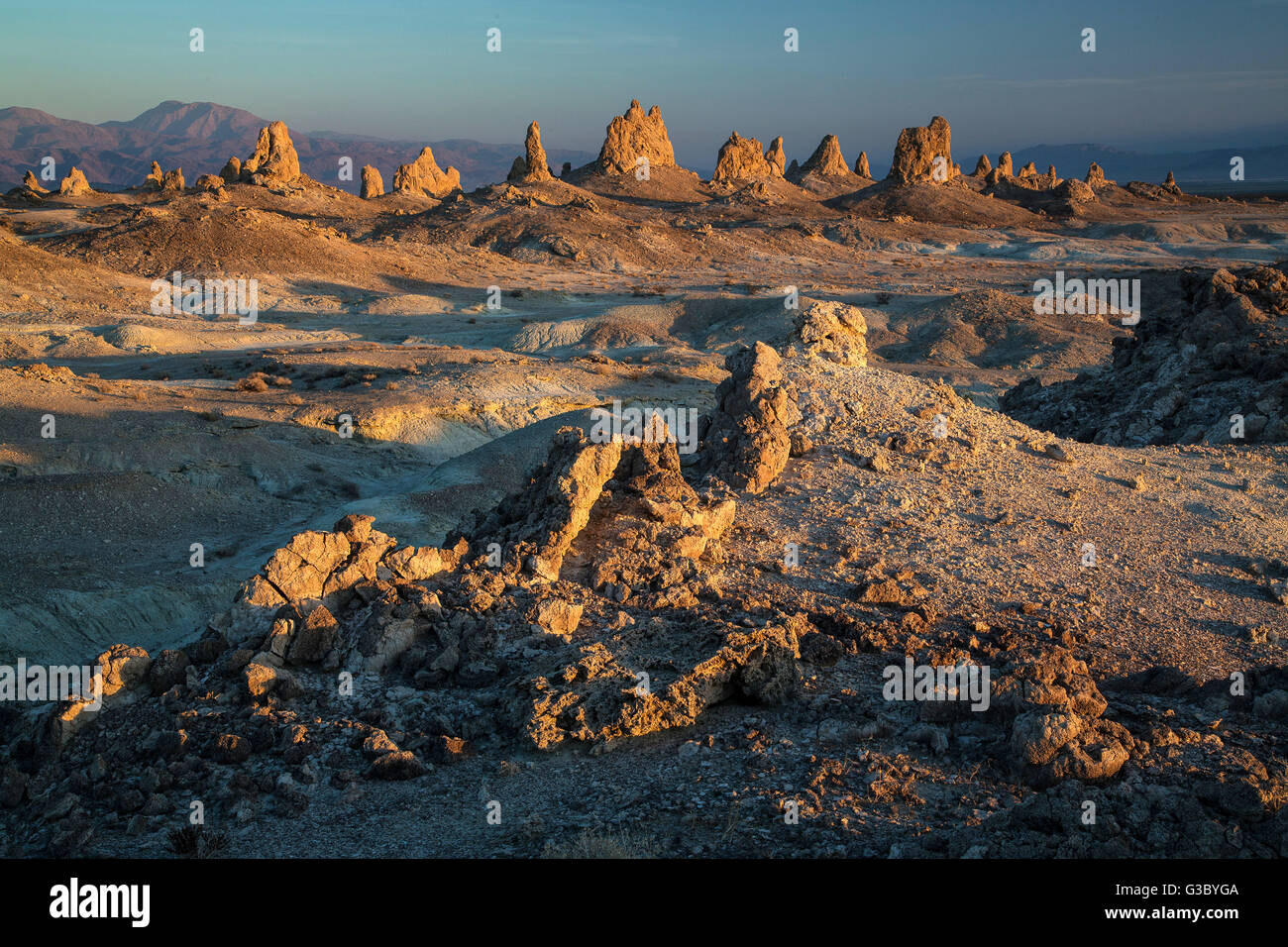Unusual geologic tufa formations known as Trona Pinnacles rising from the California Desert National Conservation Area at the Searles Dry Lake basin in Trona, California. Stock Photo