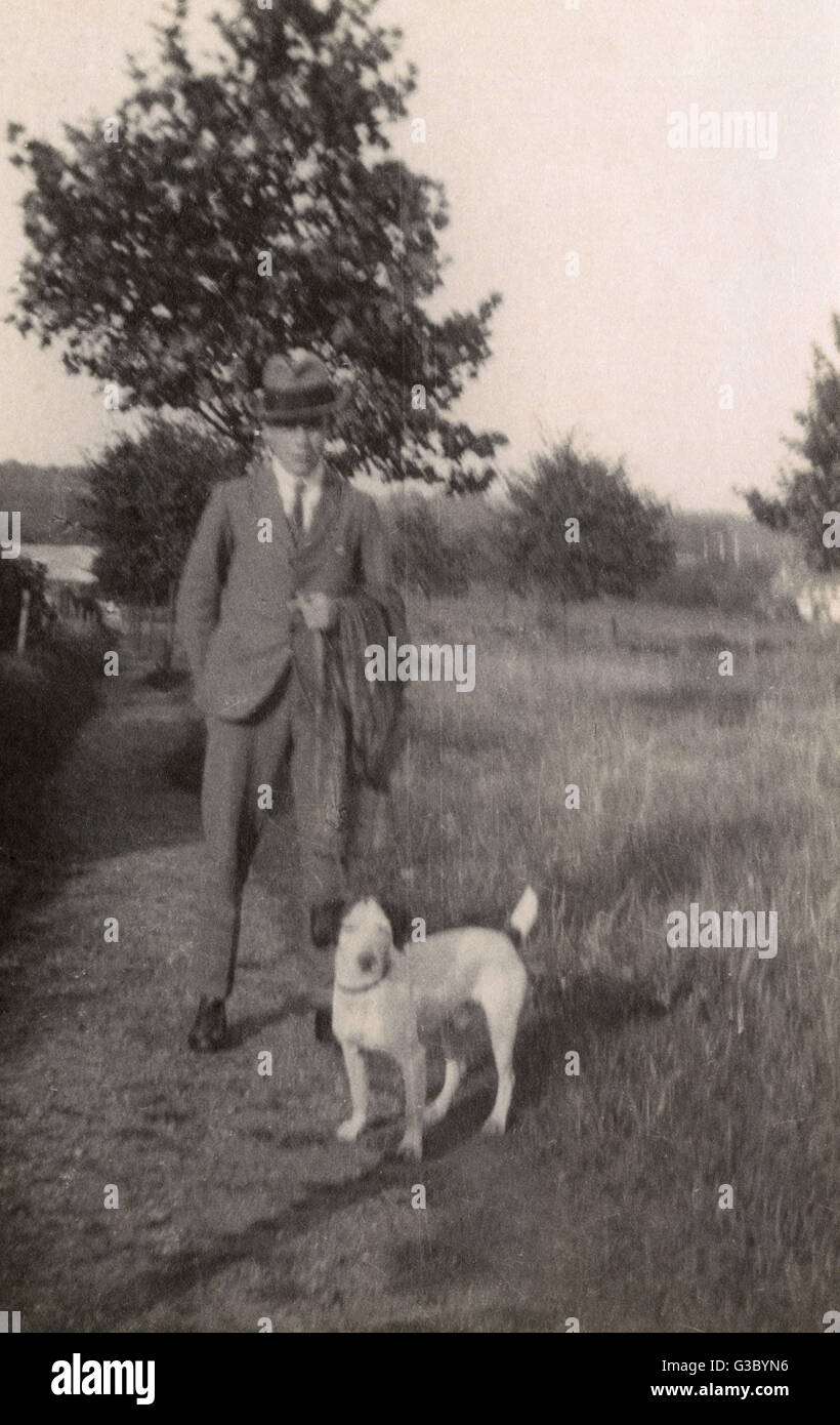 Man with dog in the park Stock Photo - Alamy