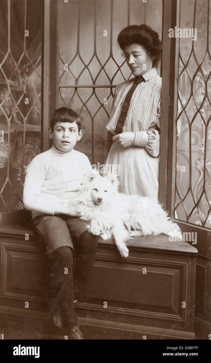 Mother and son with an American Eskimo Stock Photo