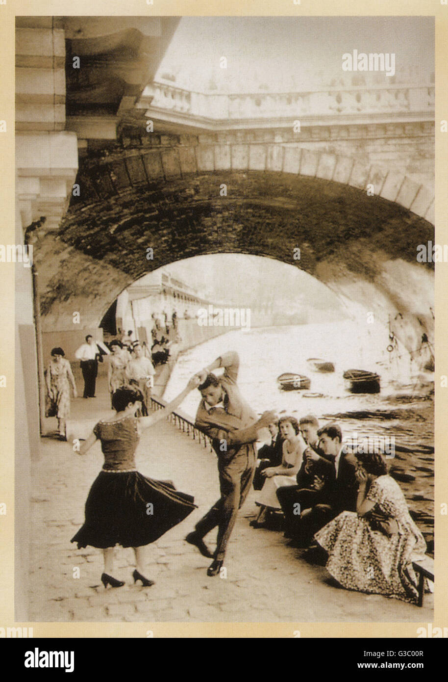 Young North Africans (from Algeria) dance on the Paris Quais.     Date: circa 1950s Stock Photo