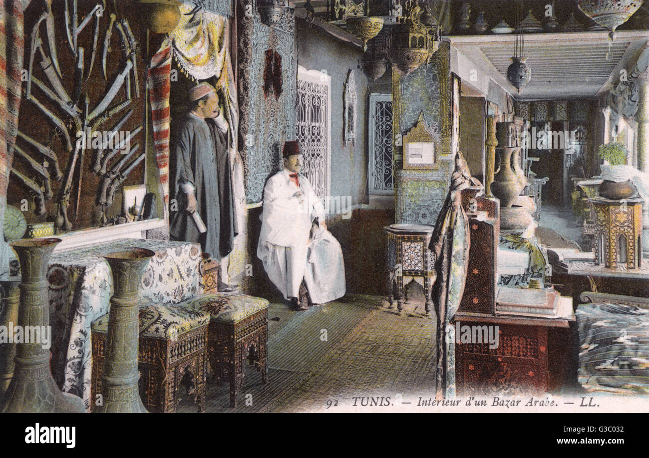 Lavish interior of an Arab Bazaar, Tunis, Tunisia     Date: circa 1910s Stock Photo