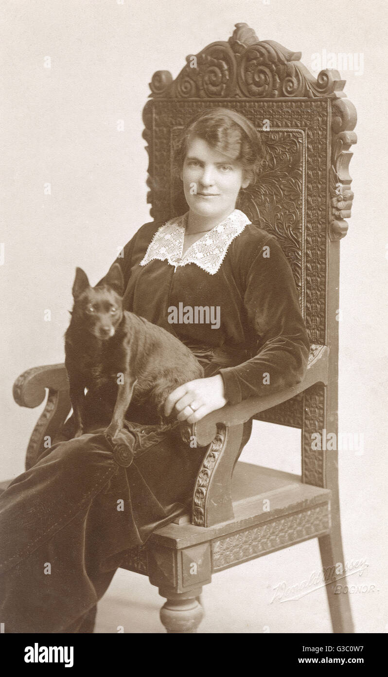 Studio portrait, woman with dog Stock Photo