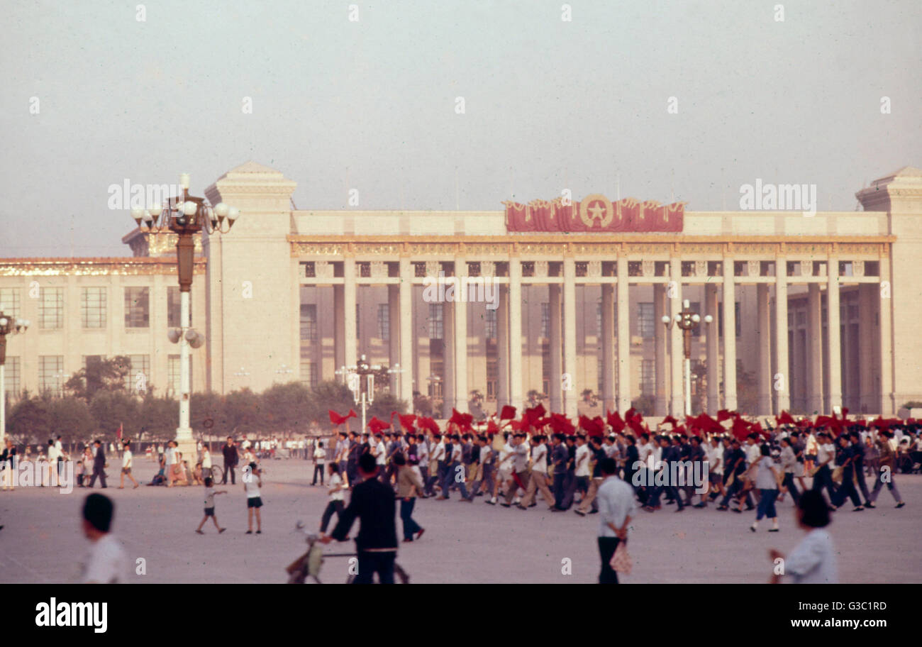 People marching with red flags in Tiananmen Square, Peking (Beijing), China,  with the museum in the background. Date: circa 1960s Stock Photo - Alamy