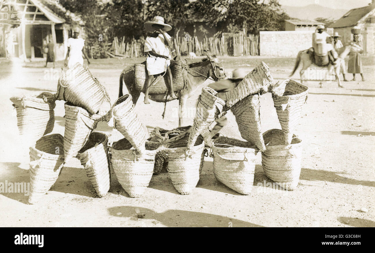 Young street vendor of woven bags, Mexico.      Date: circa 1925 Stock Photo