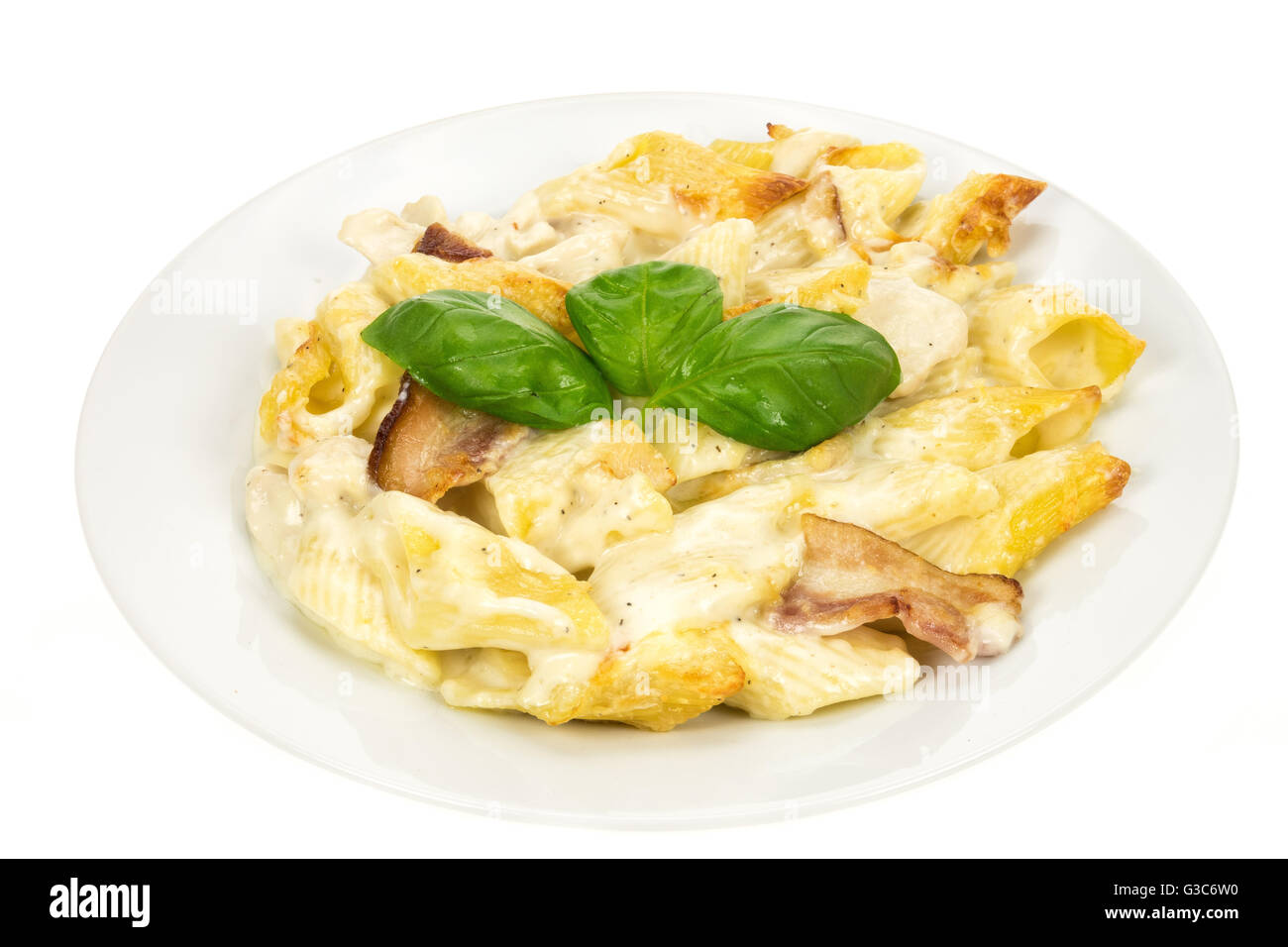 Chicken and bacon pasta meal on a plate - white background Stock Photo