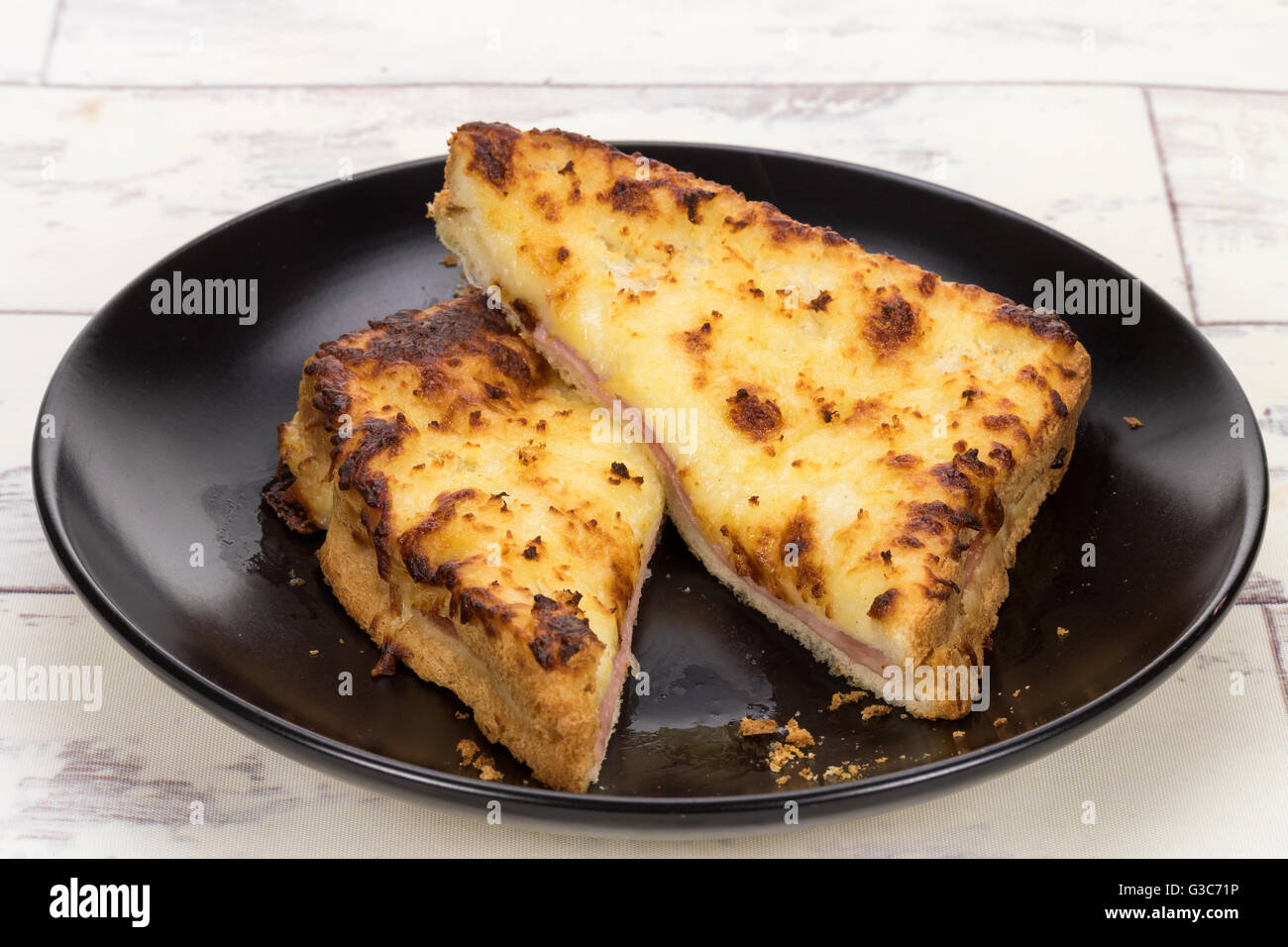 A delicious toasted cheese and ham panini croque monsieur sandwich Stock Photo