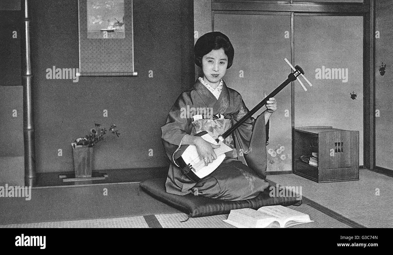 Japan Music Teacher playing a Shamisen Stock Photo Alamy