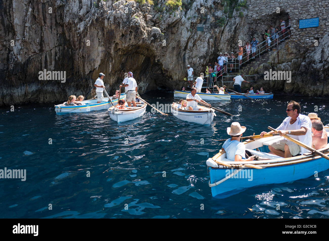 Capri, Italy - August 5, 2015: Boats with tourists waiting to get into the  Blue Grotto Stock Photo - Alamy