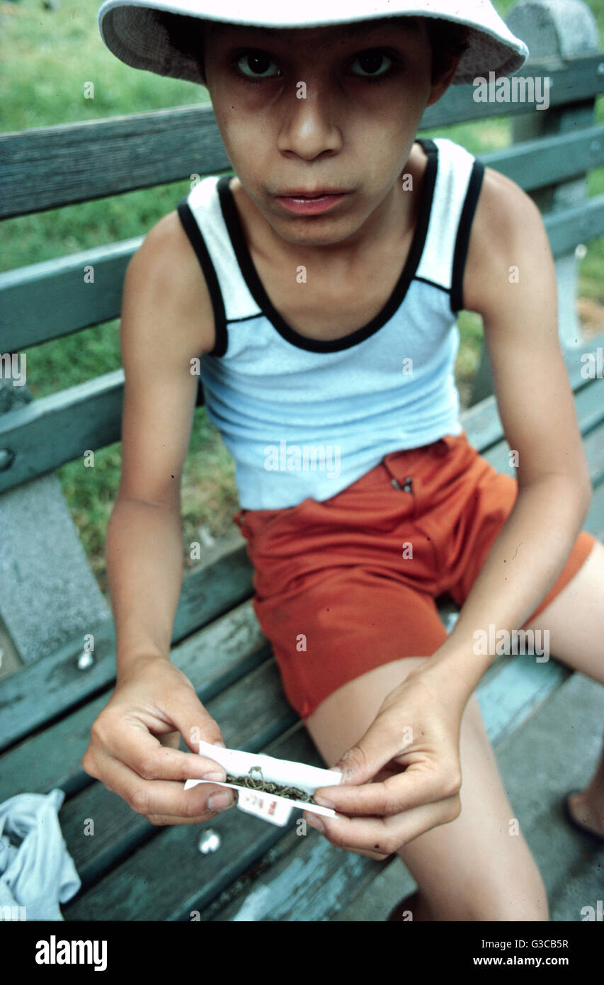 New York, young boy rolling joint, drug abuse, marijuana, cannabis, addict Stock Photo