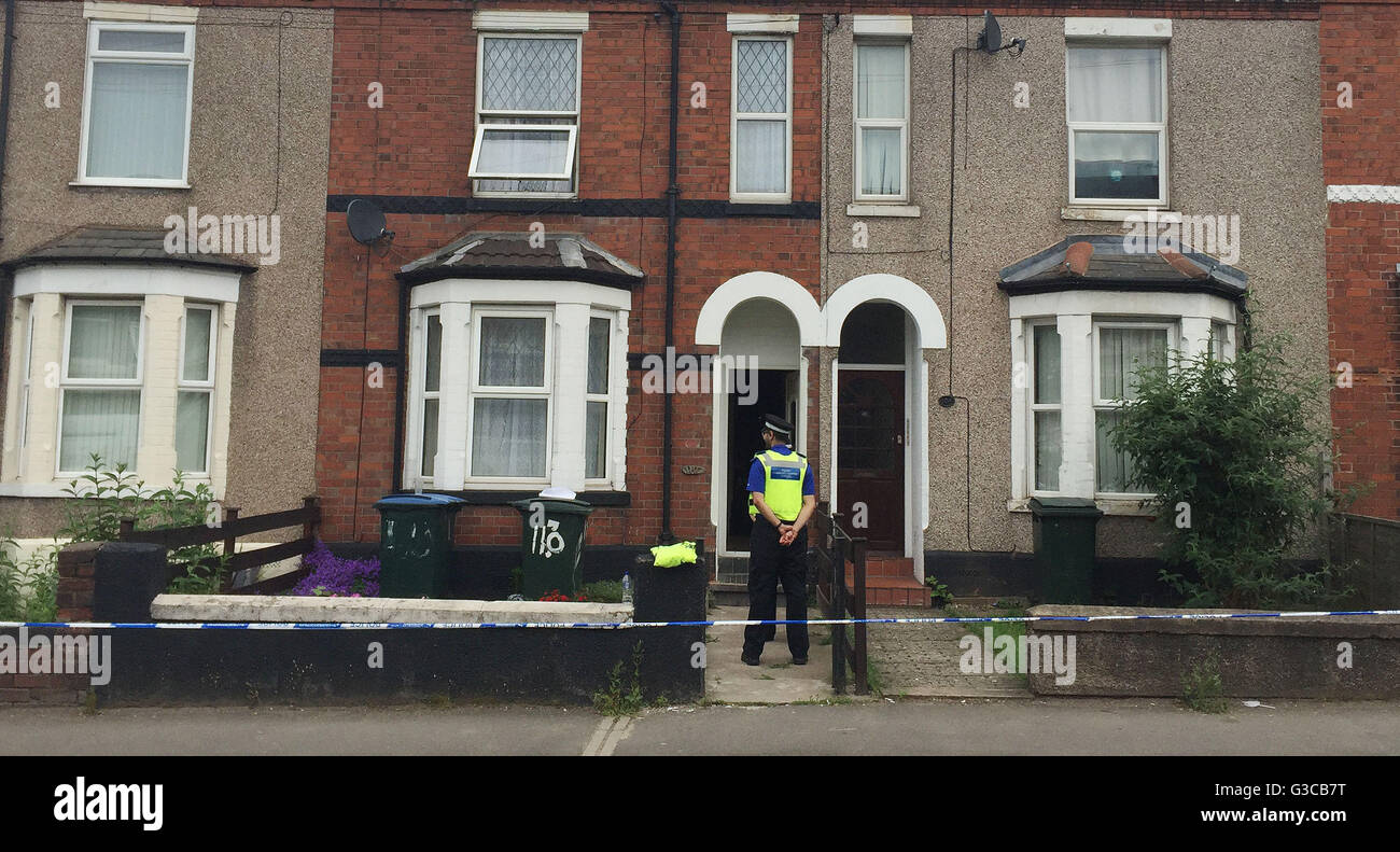 Police officers outside a terraced house in Holyhead Road, Coventry, where a man collapsed and