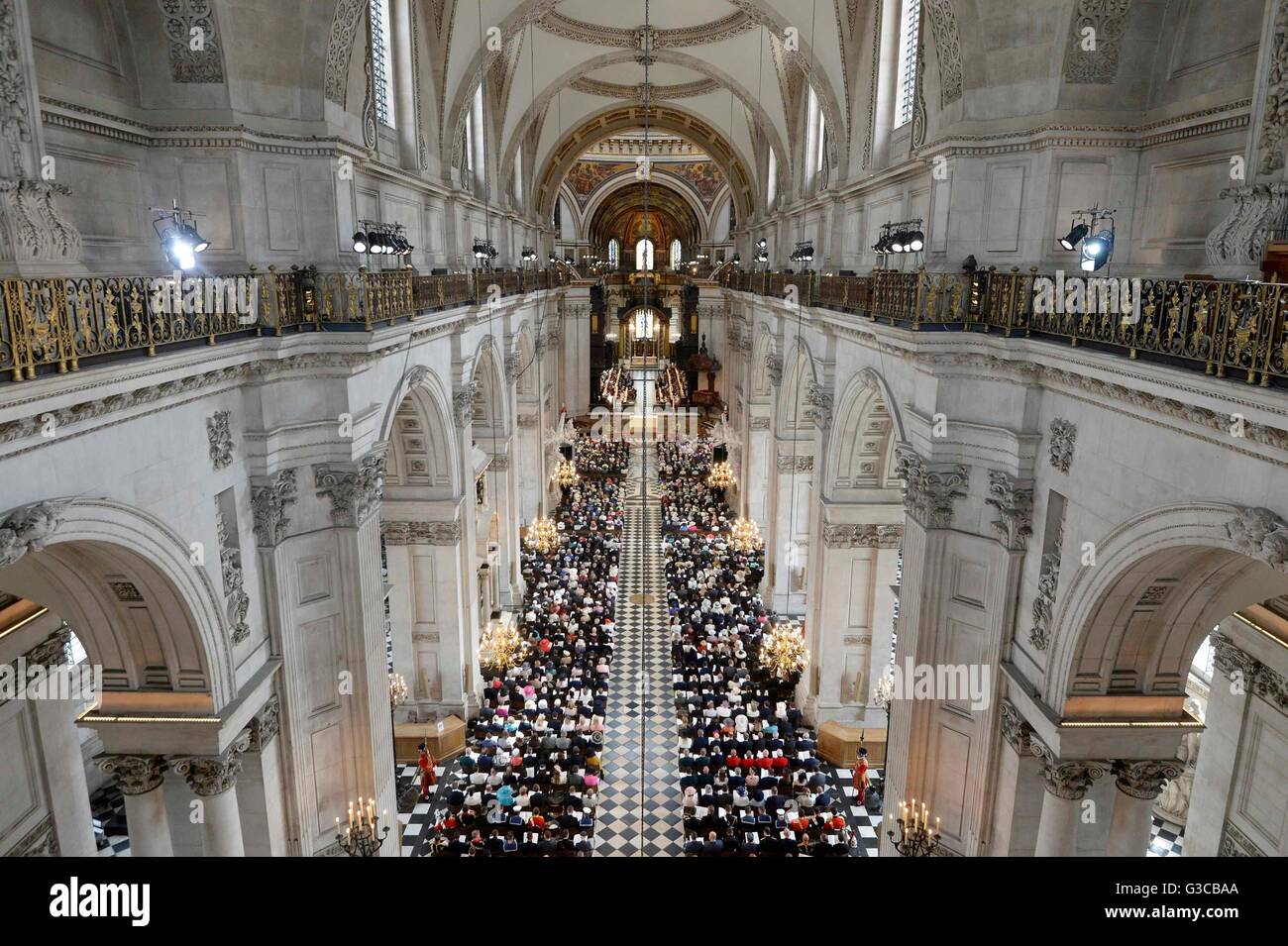 The congregation sit during a national service of thanksgiving to celebrate the 90th birthday of Queen Elizabeth II at St Paul's Cathedral in London. Stock Photo