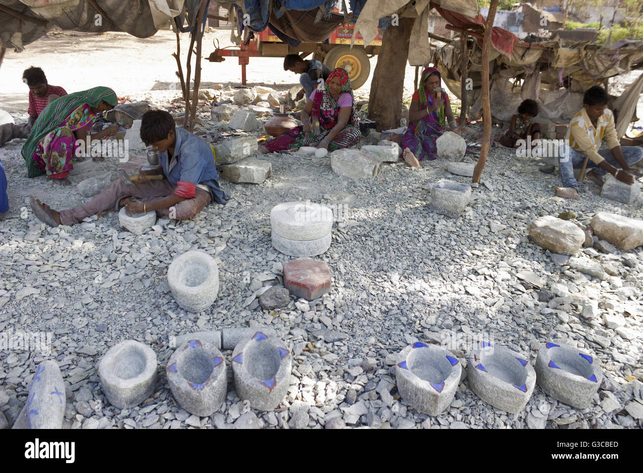 Workers making mortar and pestle stone masala grinders. Baroda, Gujarat