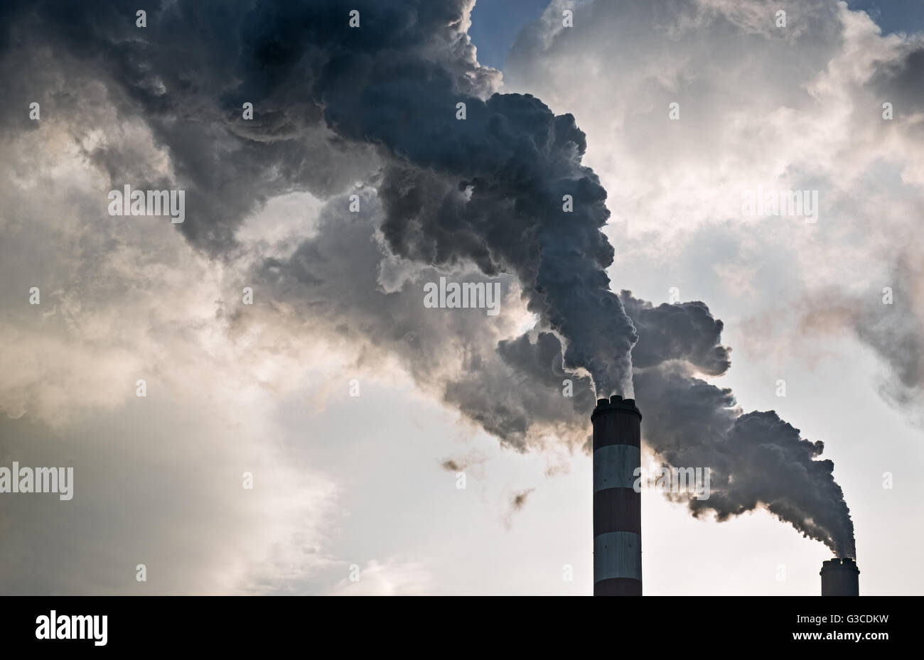 The smoke from the chimneys of a power plant Stock Photo - Alamy
