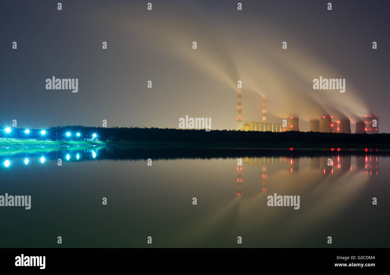 The smoke from the chimneys of a power plant at night Stock Photo - Alamy