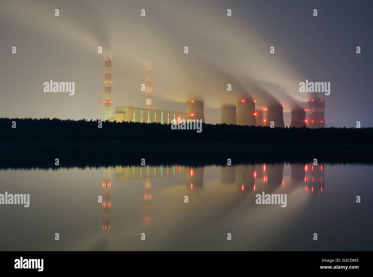 The smoke from the chimneys of a power plant at night Stock Photo - Alamy