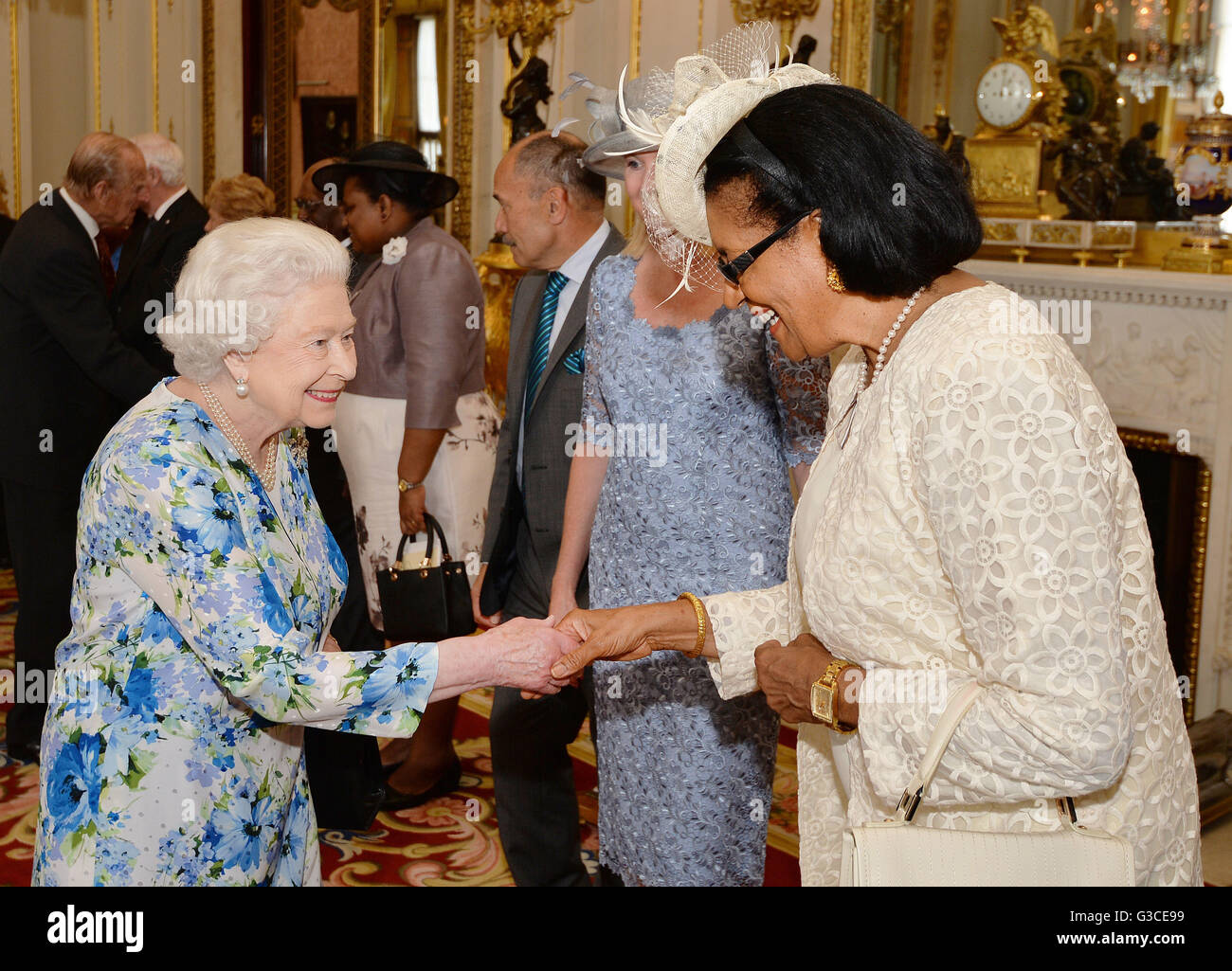 Queen Elizabeth II shakes hands with Dame Cecile La Grande of Grenada, during a reception ahead of the Governor General's lunch at Buckingham Palace in London. Stock Photo