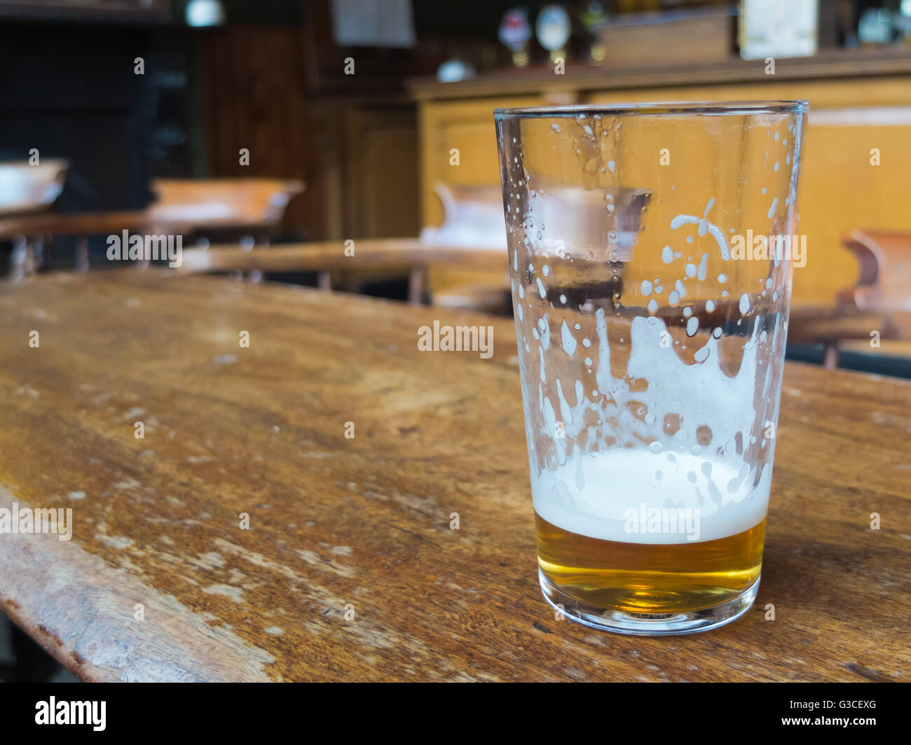 beer glass on bar table Stock Photo - Alamy