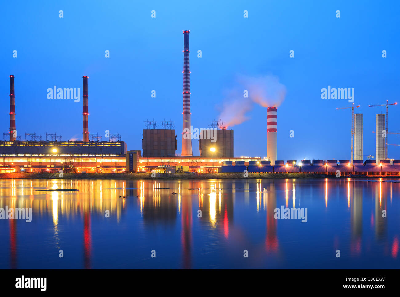 The smoke from the chimney power plant at night Stock Photo - Alamy
