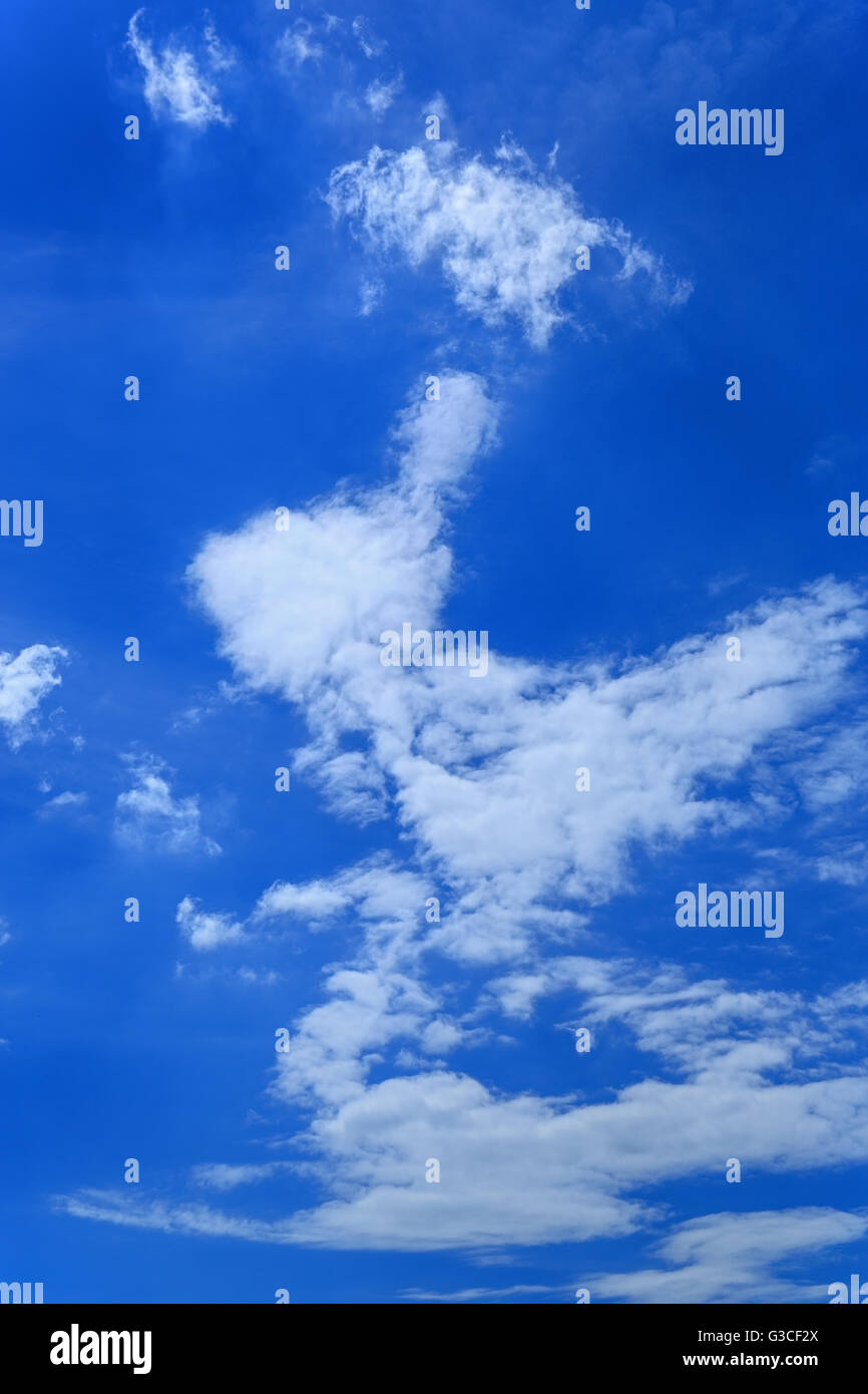 Blue sky with clouds as a background Stock Photo - Alamy