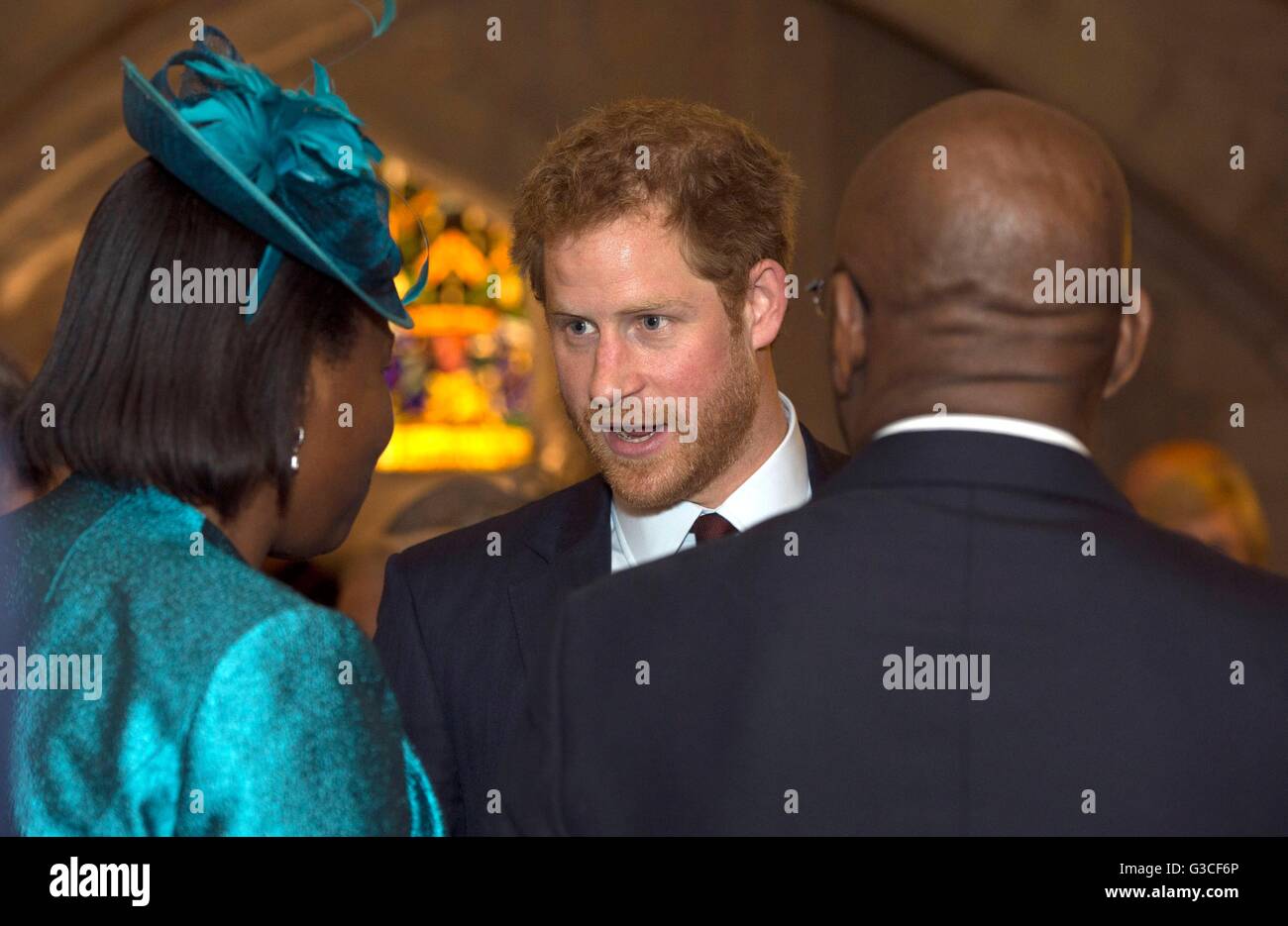 Prince Harry talks to the High Commissioner of Grenada, Karl Hood, and Acting High Commissioner for Dominica, Janet Charles, during a reception at the Guildhall, London, following the National Service of Thanksgiving at St Paul's Cathedral as part of Queen Elizabeth II's 90th birthday events. Stock Photo