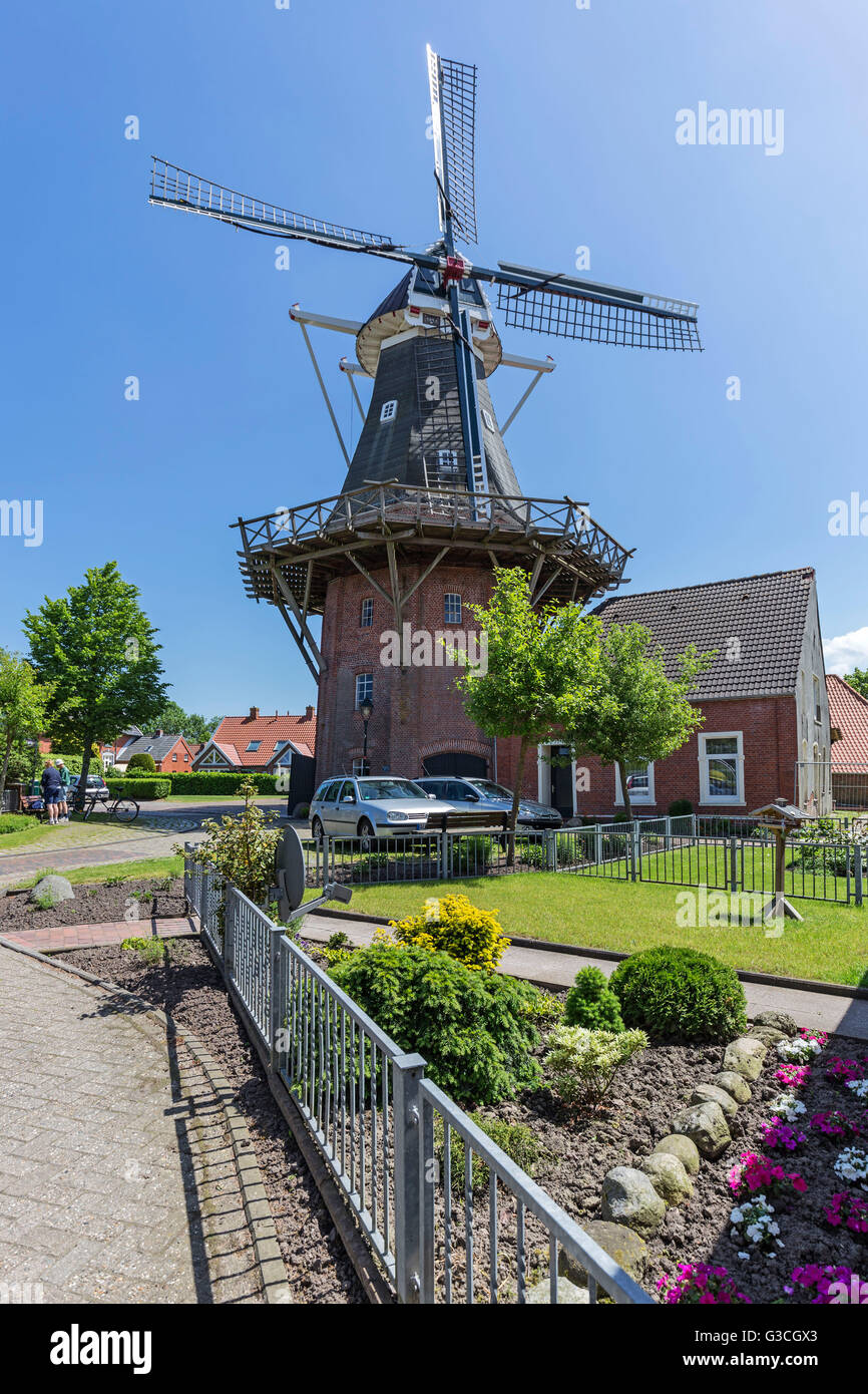 mill of Rysum, three-floor smock mill, Rundwarftendorf, Rysum, 'Krummhörn', East Frisia Stock Photo