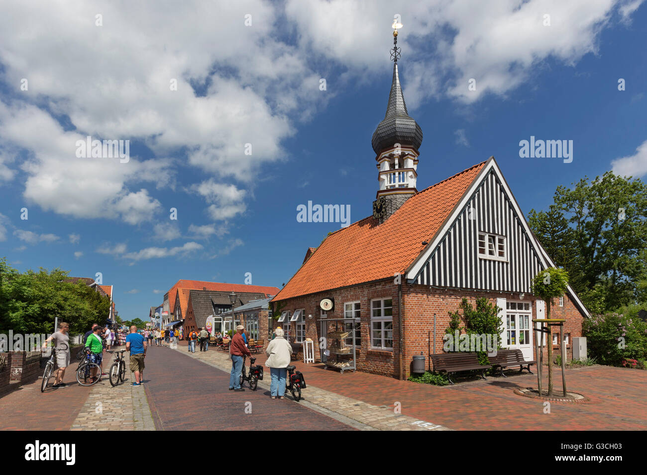 'Muschelmuseum' of Hooksiel with onion-domed tower, former 'Künstlerhaus', school, town hall, tourist information, in Hooksiel, district of the municipality Wangerland, district of Friesland, Stock Photo