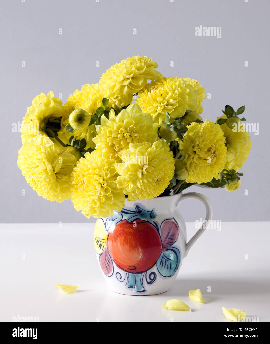 Yellow dahlias in vase Stock Photo Alamy