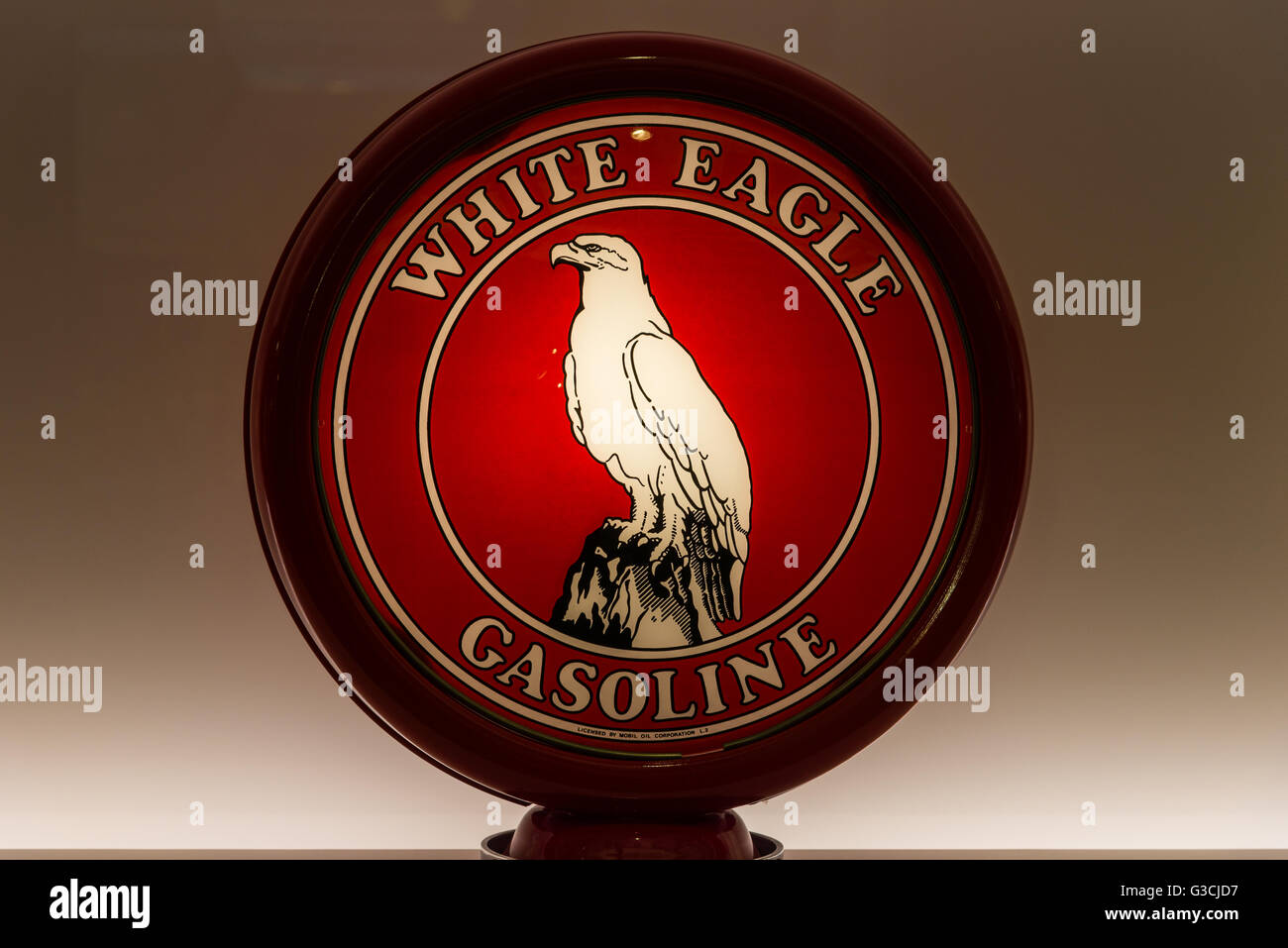 Glass globe for vintage White Eagle Gasoline gas pump in display. Stock Photo