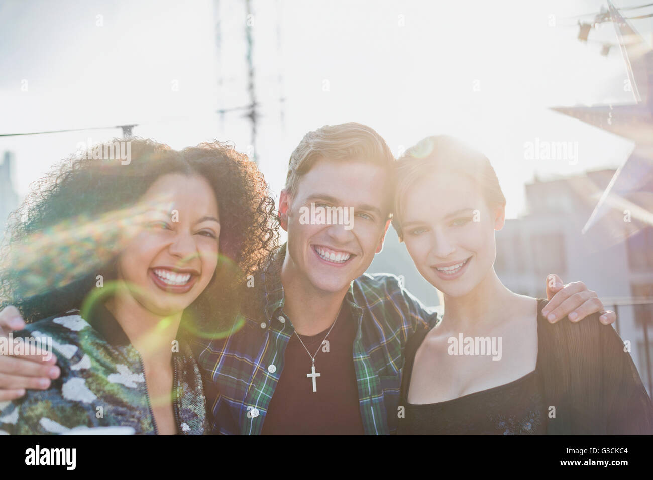 Portrait young adult friends smiling outside Stock Photo