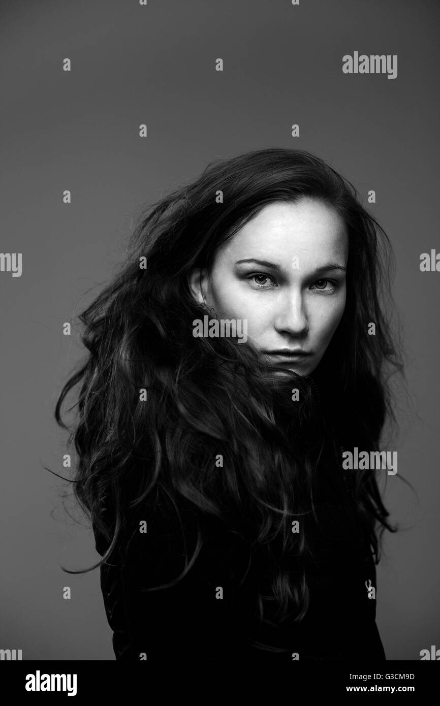 Young woman, studio shot Stock Photo - Alamy