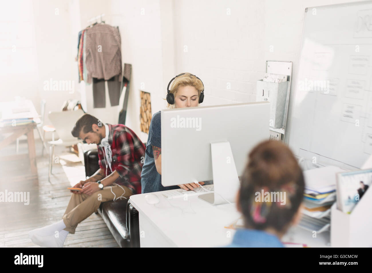 Creative young adult designers working in office Stock Photo