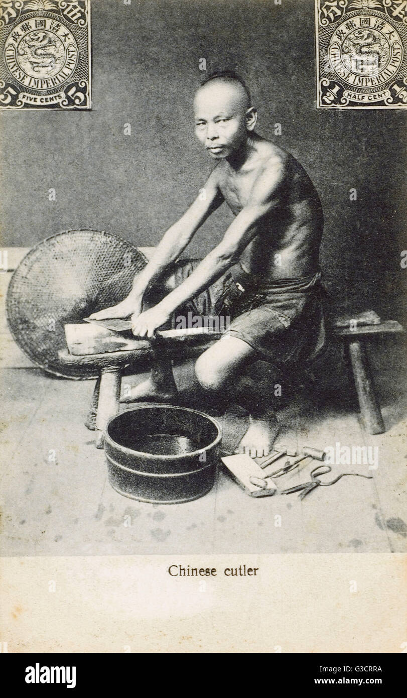 China A Chinese cutler, sharpening a Chinese Cleaver Stock Photo Alamy