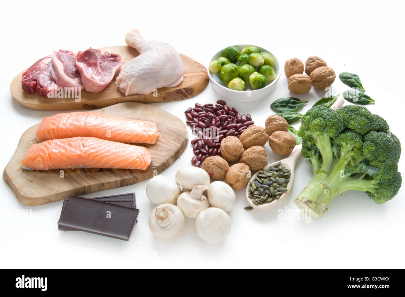 Foods sources for iron including meat, fish, pulses and seeds Stock