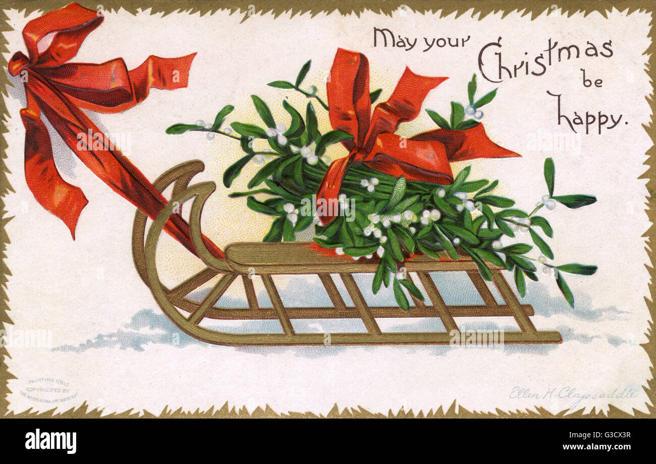 Christmas Mistletoe being pulled along atop a wooden frame Stock Photo