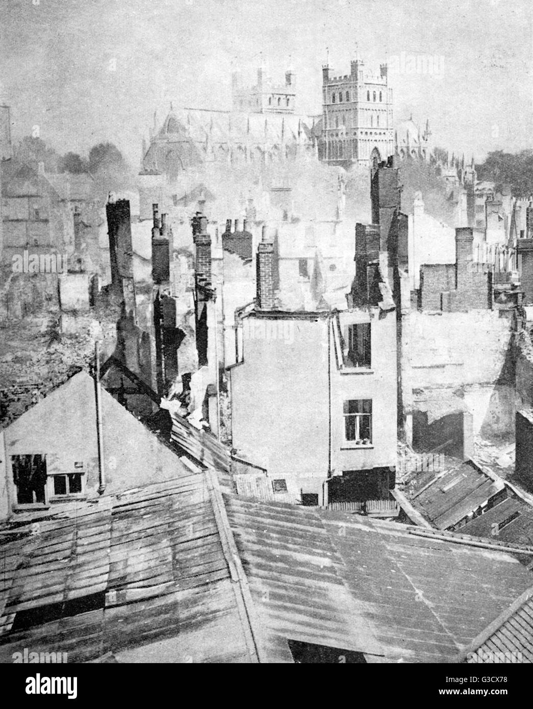 &quot;Exeter under fire&quot; - Damage sustained by bombing on the city by German planes of the luftwaffe during WW2. The Baedeker Blitz (or Baedeker raids) were targetted raids, chosen for hitting sites of cultural or historical significance, rather than Stock Photo