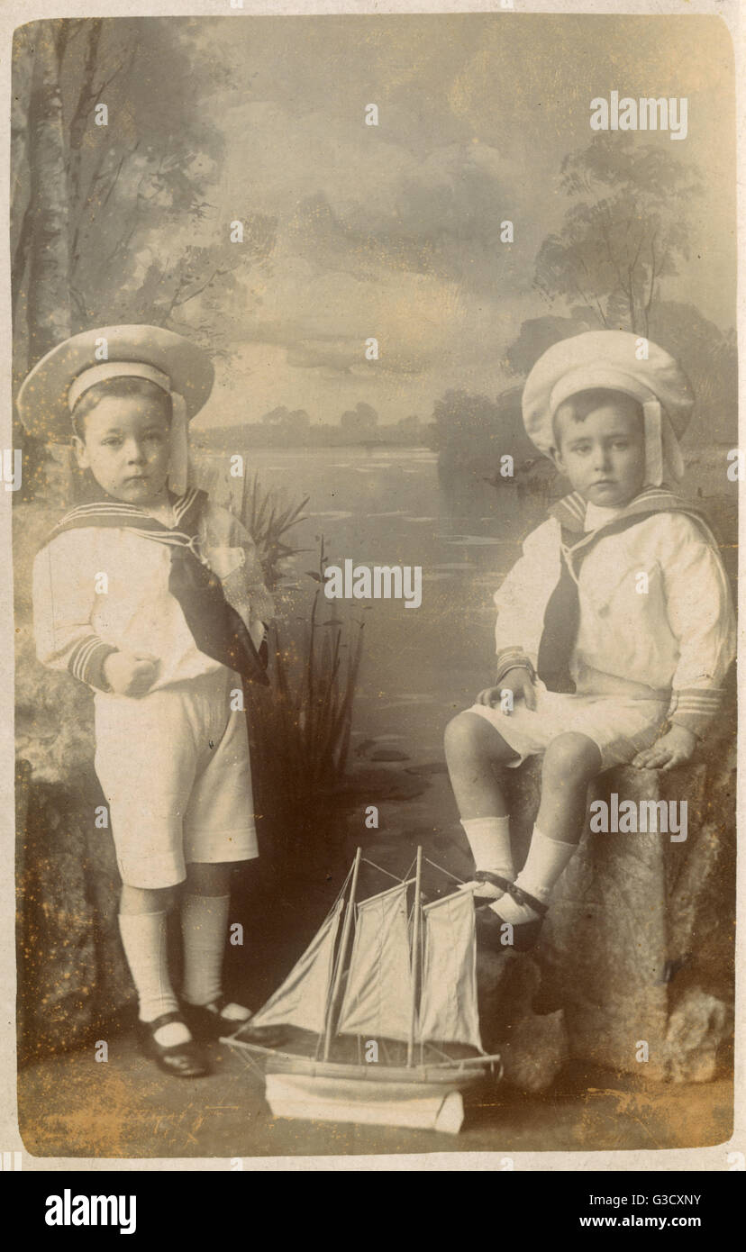 Pair of brothers in sailor suits - studio photograph Stock Photo
