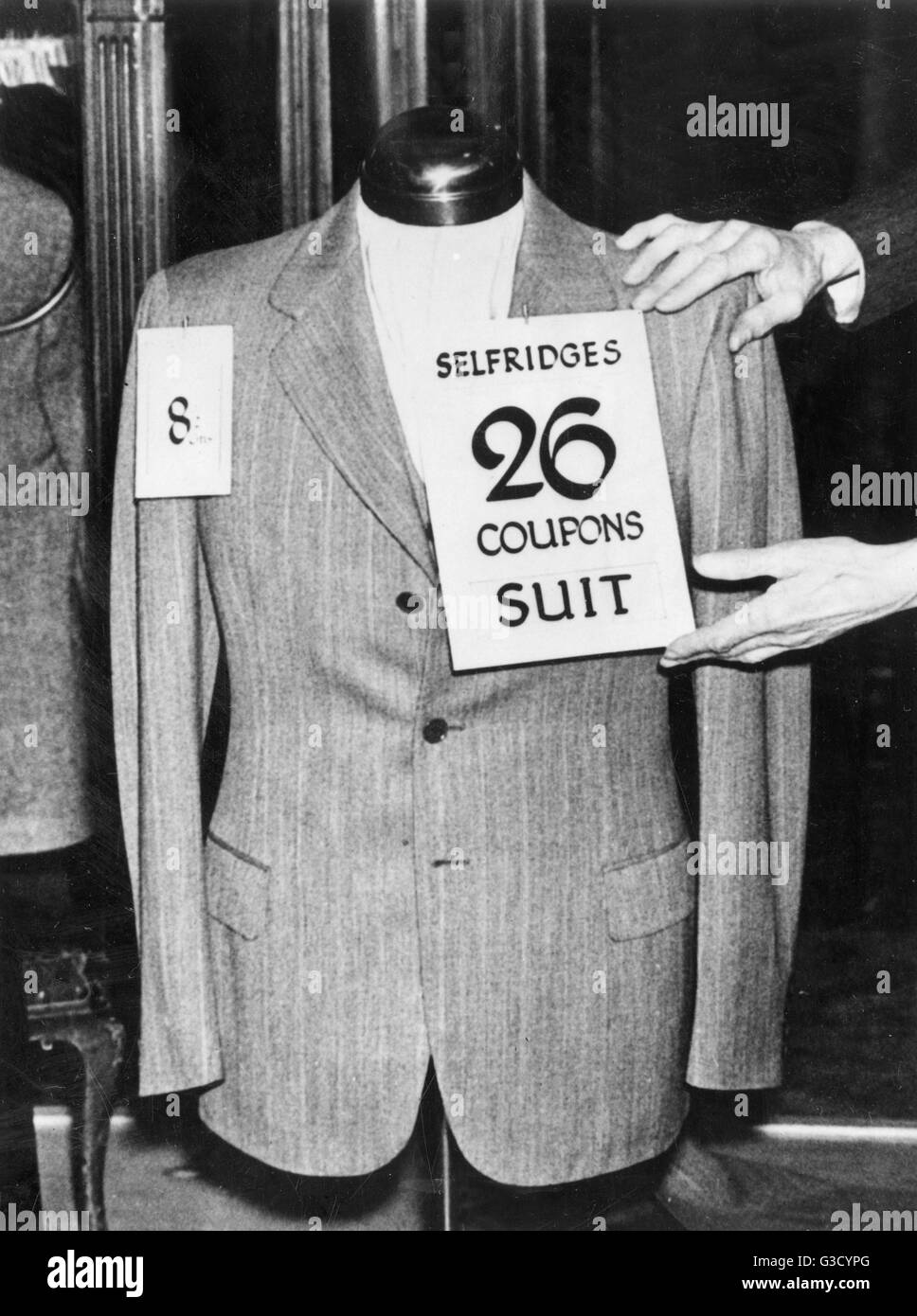 WW2 - Cost of a Selfridges 3-piece suit - Cost 8 guineas and 26 Clothing rationing coupons - 17th June, 1941. In 1942, each person had 60 coupons p.a., which reduced down to 24 coupons by 1945.     Date: 1941 Stock Photo
