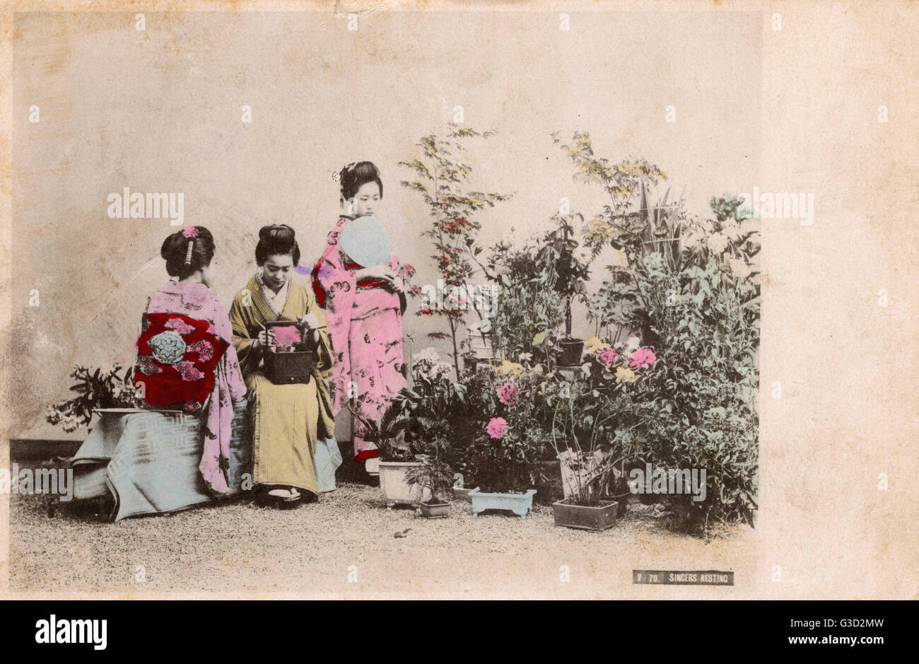 Three Japanese Geisha girls in a Garden Stock Photo