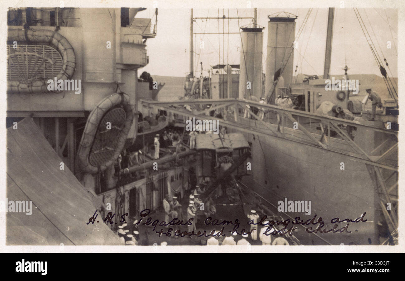 HMS Pegasus alongside HMS Marlborough recovering seaplane Stock Photo