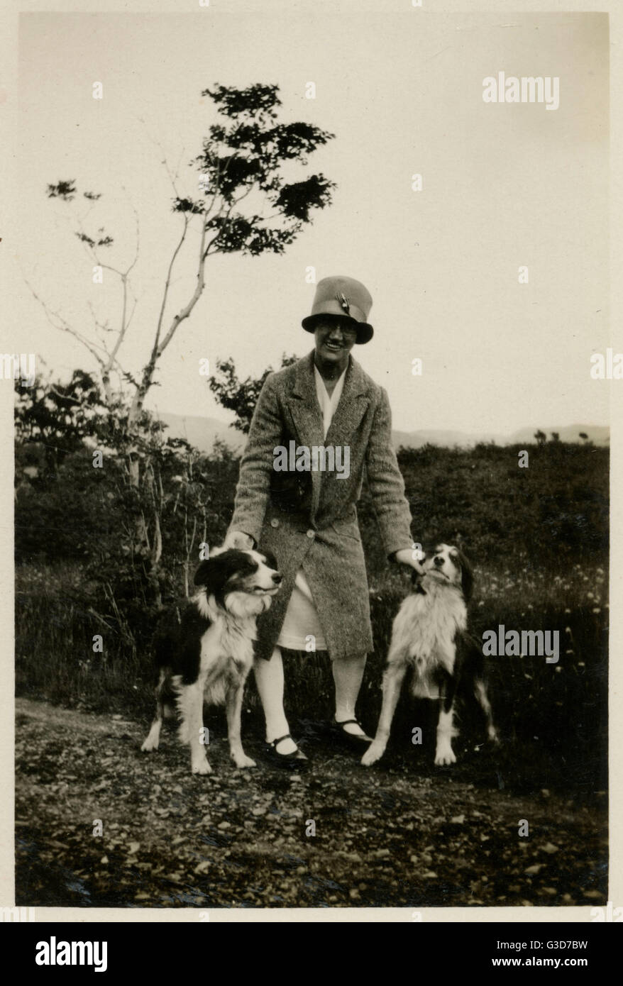Two women their dogs in garden hi-res stock photography and images - Alamy