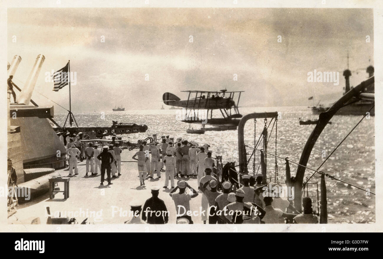 WW2 Launching seaplane from deck catapult of a US Battleship Stock Photo