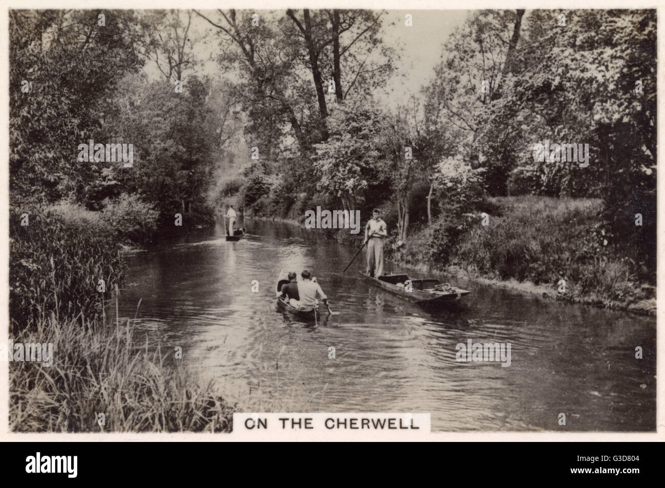 British Countryside - Punting and rowing on the River Cherwell, a tributary of the Isis (or Upper Thames), which it joins at Oxford.     Date: 1938 Stock Photo